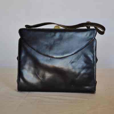 Soft leather flap bag with gold clasp, leather handle