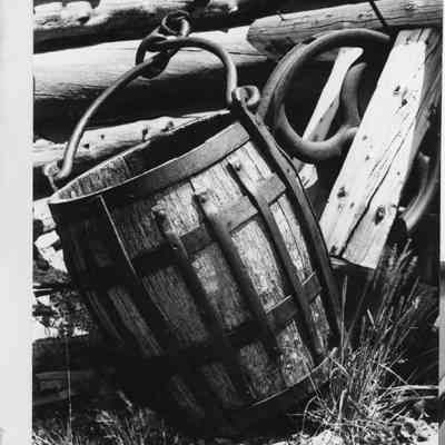 3. Ironbound: The mine bucket. The bucket is from an old mine above Pile Hill near Apex.: Photo is attached to white sheet of notebook paper. 4.5"x6.5" black and white print.