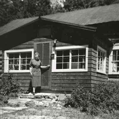 6. Kemp cabin in Eldora.: Lois Kemp outside the Kemps' cabin in Eldora.
