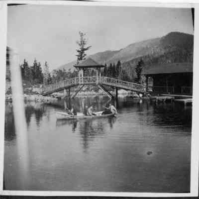 Photo 2: The Bridge of Sighs at Annie Brown's lodge with four women in canoe
