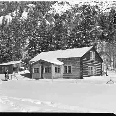 Photo from envelope 8, Lois in front of Cabin, snowstorm late March 1941