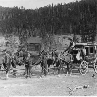 3. Stagecoach: Stage pulled by six-horse team with driver and bags.