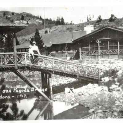 7. Mansion and Pagoda Bridge, Lake Eldora - 1917: Woman and child pose on bridge at Annie Brown's Lodge.