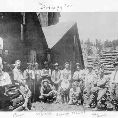 4. Smuggler Mine crew. Group includes men, women, and one child. Some are identified: Peant(?), W Clemens, B Clemens, T E Smith, Geo Evans, and Billy Sherman..: Digital only