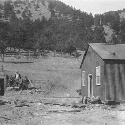 9. Group of men at mine entrance, possibly same men as Photo 7.: 8.5"x11" print and digital