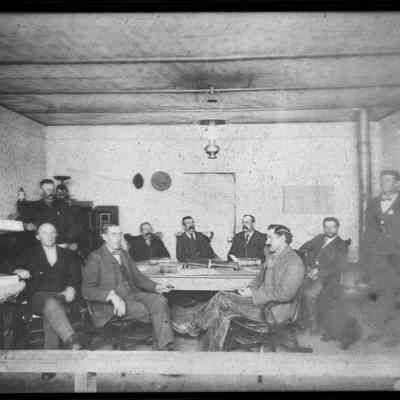4. Eldora Town Council 1899: Nine men (and dog) identified as "Town Council in Eldora 1899. Town Marshal (Ed Sperry?) standing far right. Unknown which man standing is possibly Sperry.  5"x7" negative