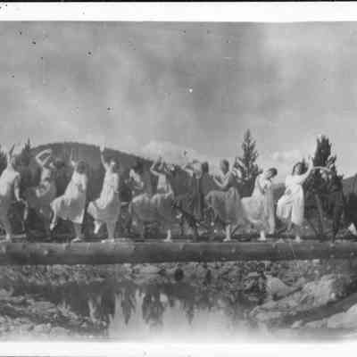 Photo 5: Women dancing on log bridge