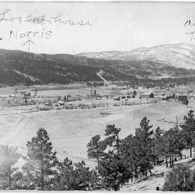 4. Nederland. Labeled are Norris Log House and Antlers Hotel.: Back side says, We lived here 1899. Fern died July 28, 1899, 3 mos old. Dad had a sawmill by the river--just across from the house. --Violet Norris