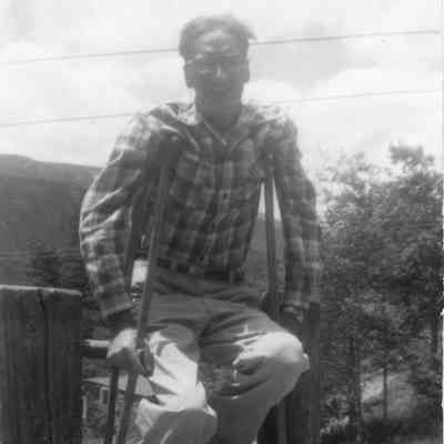 3. Man with crutches: 3"x5" black and white photo