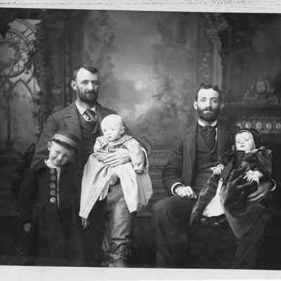 6. From back of photo: "On left believed to be John H. Kemp with sons Donald C. and Robert (on lap) circa 1893. Man on right not identified but resembles Kemp- may have been a brother.: 9.5"x7.5" photo mounted on cardboard (may not be acid-free)