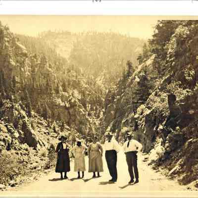 14. Five people in road: Three women and two men
