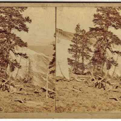 17. Two men with antlers and rifle: Stereograph