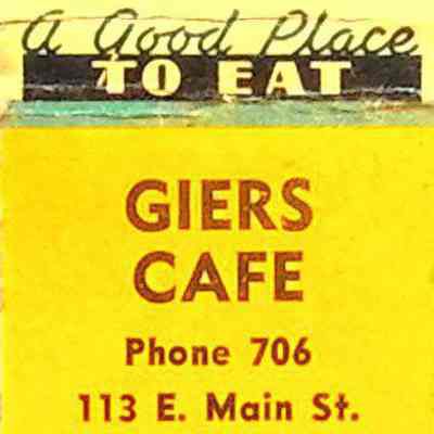 Giers Cafe Matchbook: Gold and blue (b) A Good Place to Eat featuring a winter scene "Road to Home". Inside cover: "Blue Ribbon & Schlitz on draft at all times also liquor".