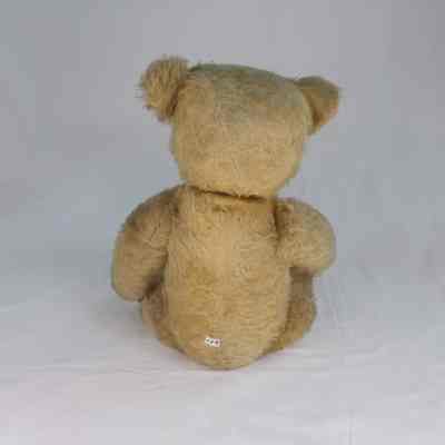 Bear with light tan cotton fur and black button eyes