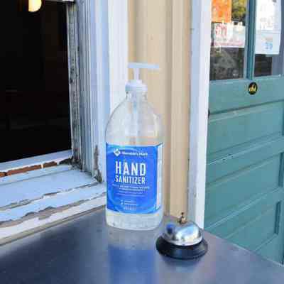 Bell and hand sanitizer at Kome Thai & Sushi Bistro