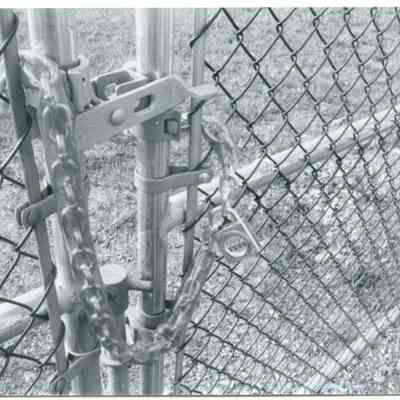 Close-up of lock on chain fence