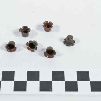 Six brass percussion caps