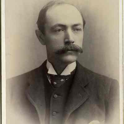 Man with a mustache in a suit