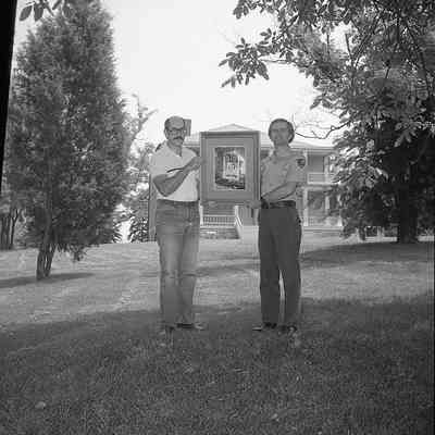 Superintendent Donald W. Campbell receiving photograph