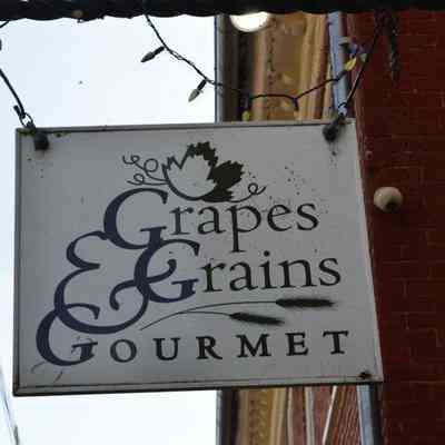 Grapes & Grains Gourmet hanging sign