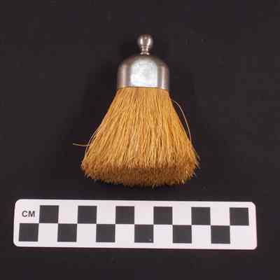 Small brush, possibly for brushing off clothing