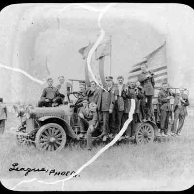 Car, men in uniform, flags