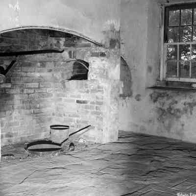 Fireplace in Happy Retreat stone kitchen