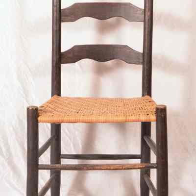 Straight ladder back chair with woven seat