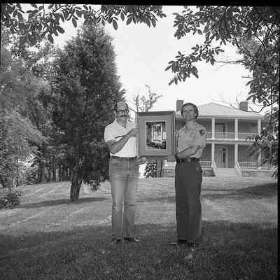 Superintendent Donald W. Campbell receiving photograph: Origformat: Other