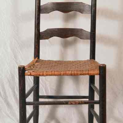 Straight ladder back chair with woven seat