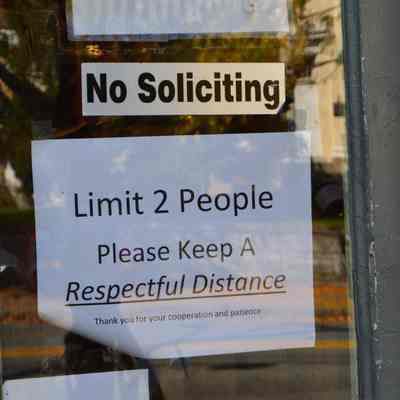 Pandemic sign at Grapes & Grains Gourmet