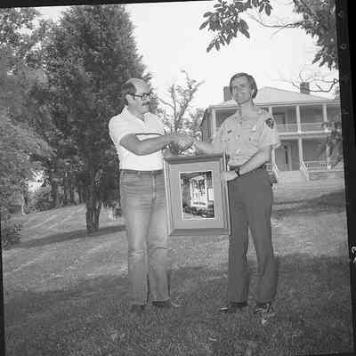 Superintendent Donald W. Campbell receiving photograph: Origformat: Other
