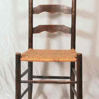 Straight ladder back chair with woven seat