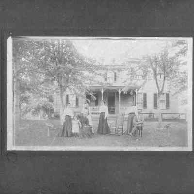 Ellen Ramey, et al., in front of Ramey House on Route 51