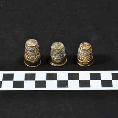 Three brass thimbles