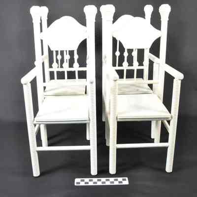 Four white painted straight chairs for a doll