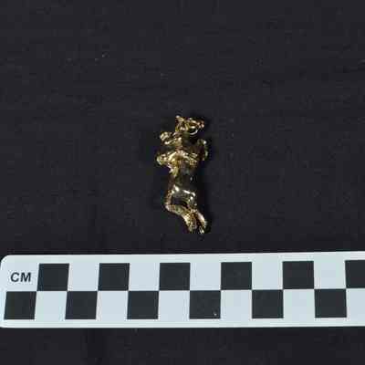Brass pin shaped as jockey on a horse
