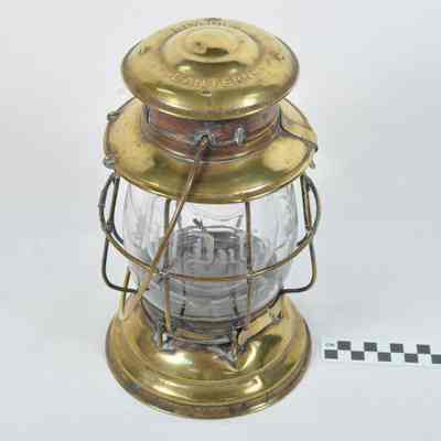 Brass railroad lantern with engraved globe
