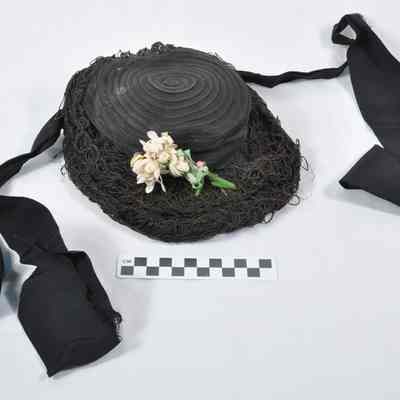 Nearly round, black child's bonnet