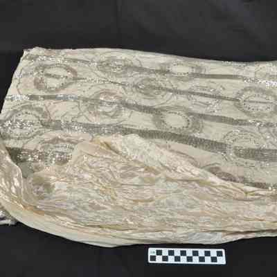 Cream colored, heavily beaded dress-bottom