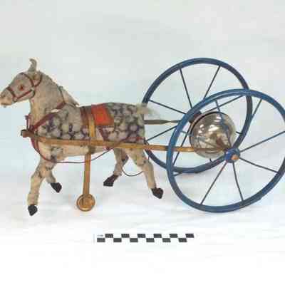 Dappled horse with bell cart