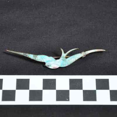 Pin in shape of a bird