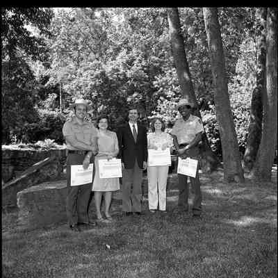 Superintendent Donald W. Campbell presenting awards to park employees
