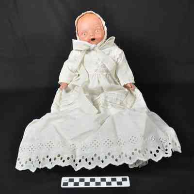 Composition baby doll wearing bonnet and long dress