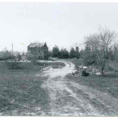 Exterior view of farmhouse and road