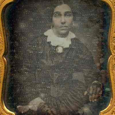 Woman in black dress with white collar
