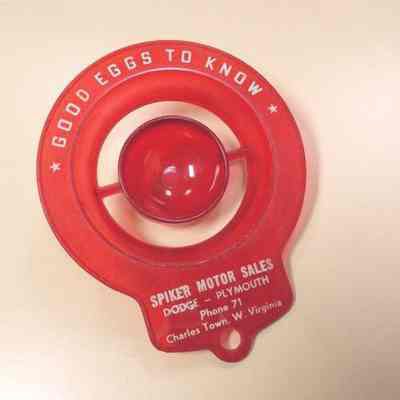 Red plastic egg separator advertising Spiker Motor Sales
