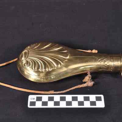 Shiny brass powder flask