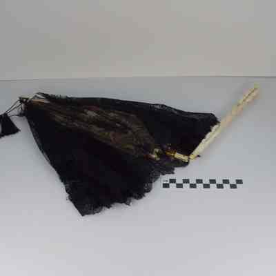 Black lace parasol with ivory handle and ivory finial