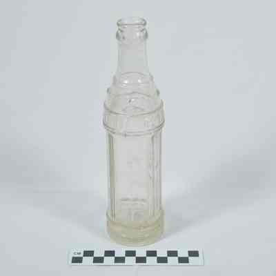 Clear glass soft drink bottle